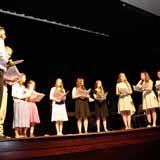 Students singing on stage